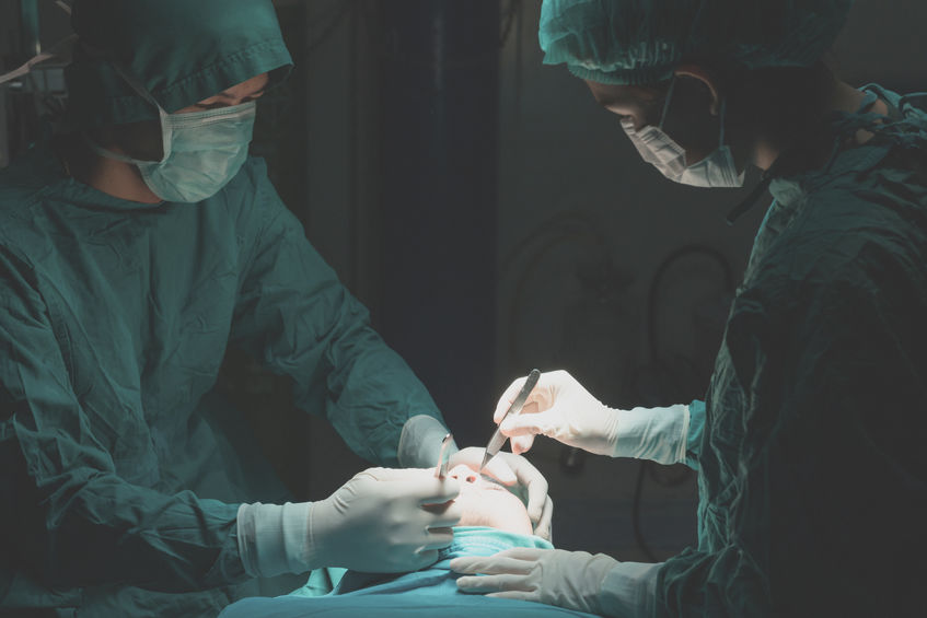 Plastic surgery wrinkle reduction , asian man during surgery usi